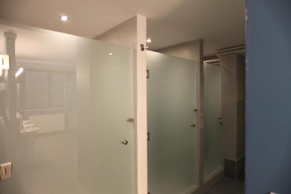Shower, towels, shampoo, toilet paper