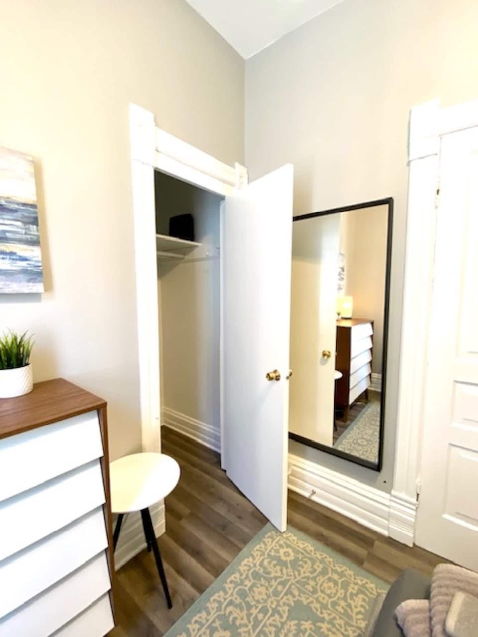 Comfortable queen bedroom with storage space for unpacking during longer stays.