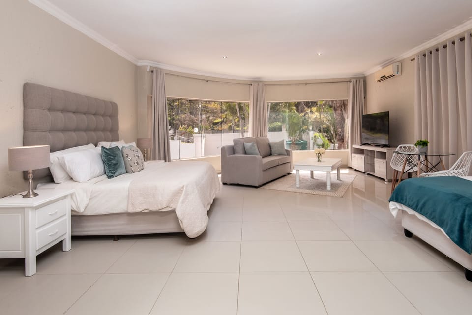 Family Suite | Minibar (free items), in-room safe, blackout drapes, iron/ironing board