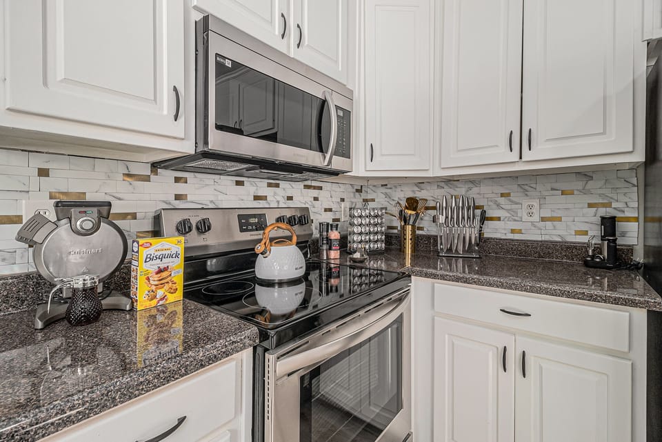 Kitchen- Fully stocked with pots, pans, and utentsils