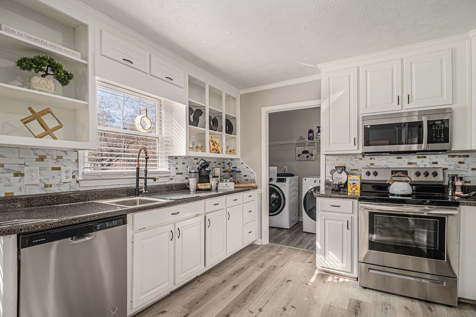 Kitchen- Fully stocked with pots, pans, and utentsils