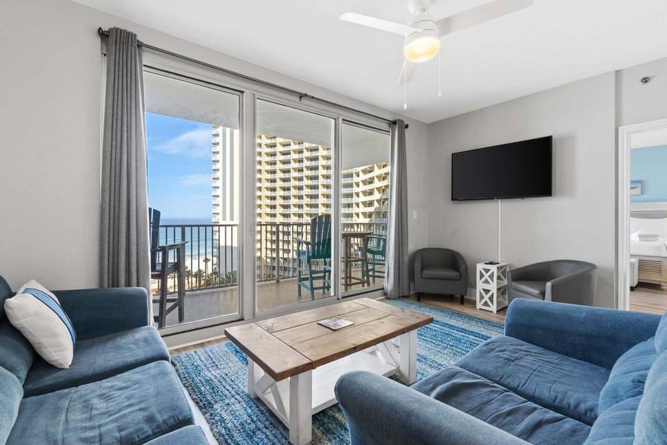 Sliding glass doors fill the room with natural light and lead directly to the balcony for effortless indoor‑outdoor living.