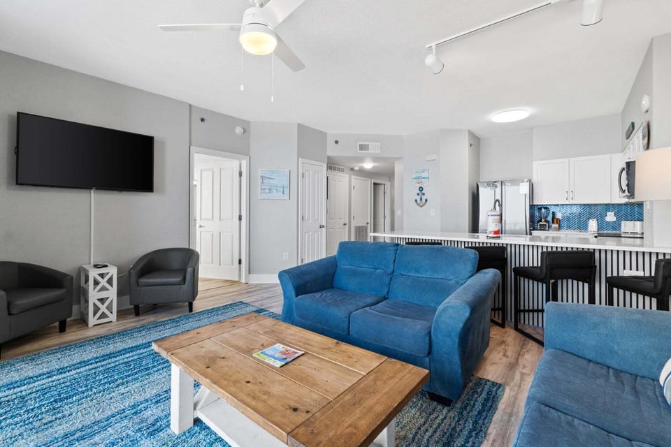 The living room is a bright, spacious gathering area designed for easy vacation living.