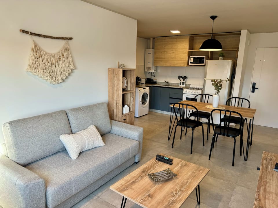 Standard Apartment | Living area | 32-inch flat-screen TV with cable channels