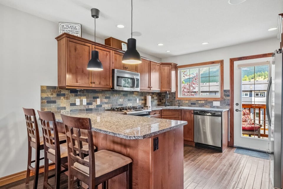 Full kitchen with access to the second balcony with a BBQ.