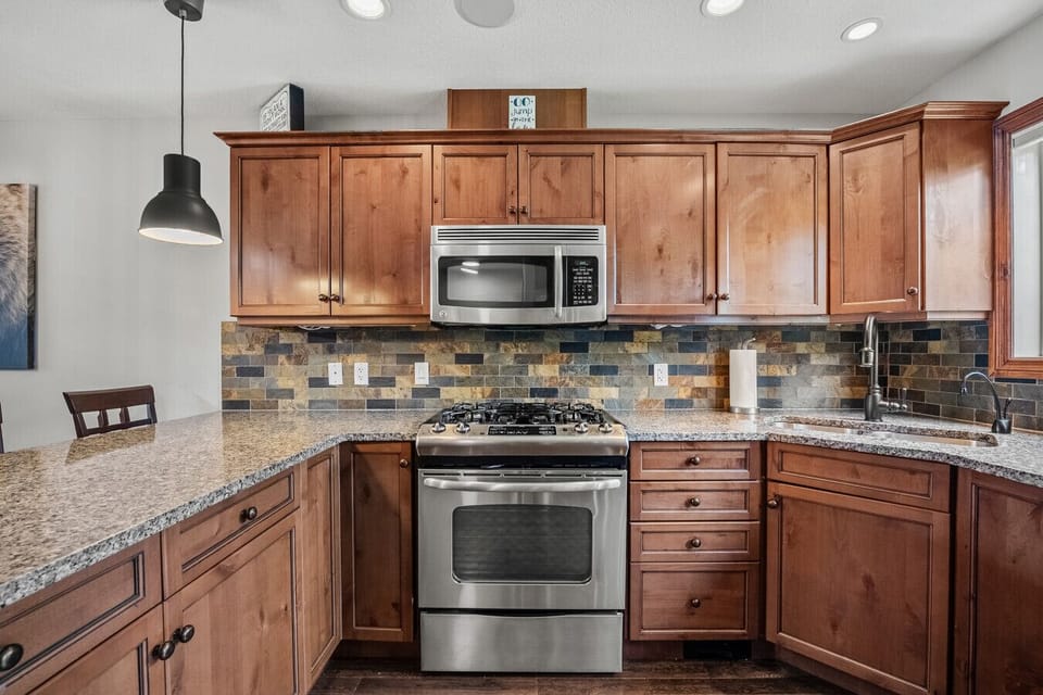 Full kitchen with access to the second balcony with a BBQ.