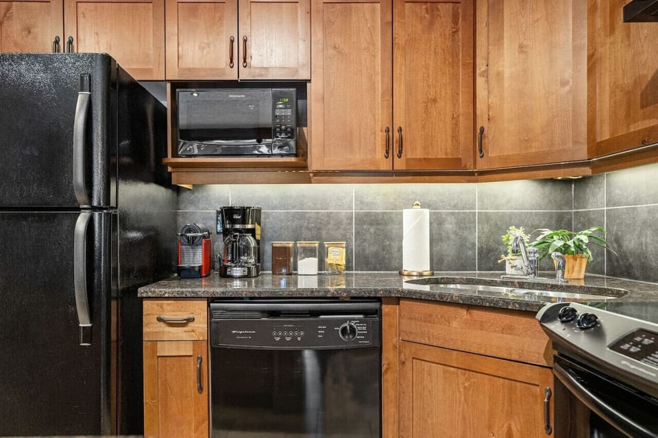 Full kitchen with all the essentials plus two coffee makers (Drip & Nespresso), a blender, and a crockpot/slow cooker. We also stock the unit with ground coffee, sugar, tea, ketchup, mustard & relish.