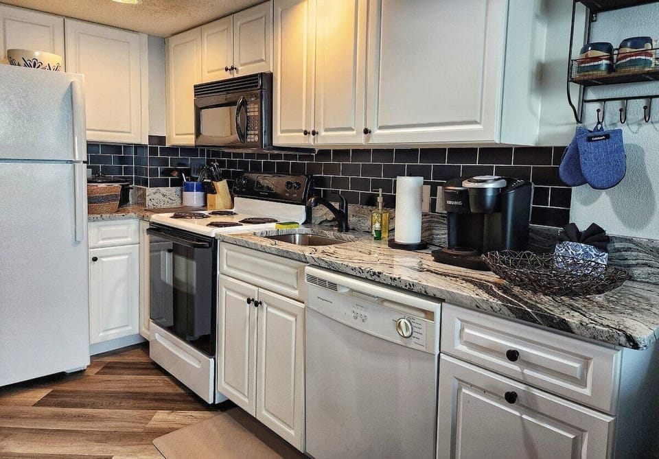 Gourmet Kitchen: Whip up delicious meals in a sleek space with modern appliances and stylish decor!