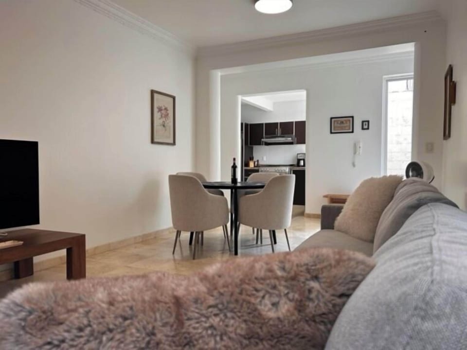 Deluxe Apartment | Living area | 42-inch Smart TV with digital channels