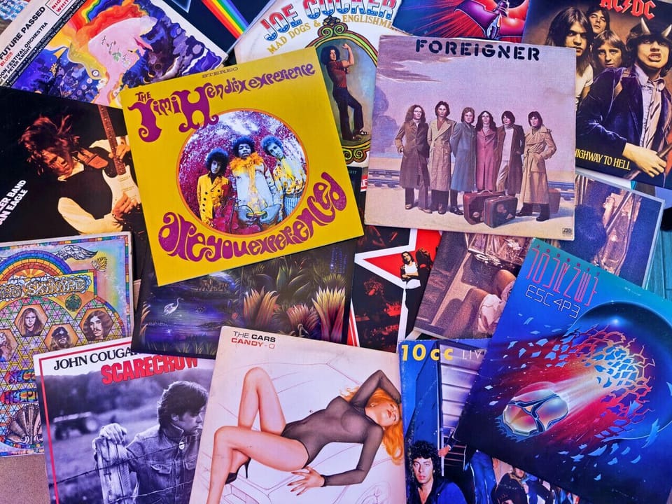 A curated vinyl collection featuring classics from Hendrix, Foreigner, Journey, and more.