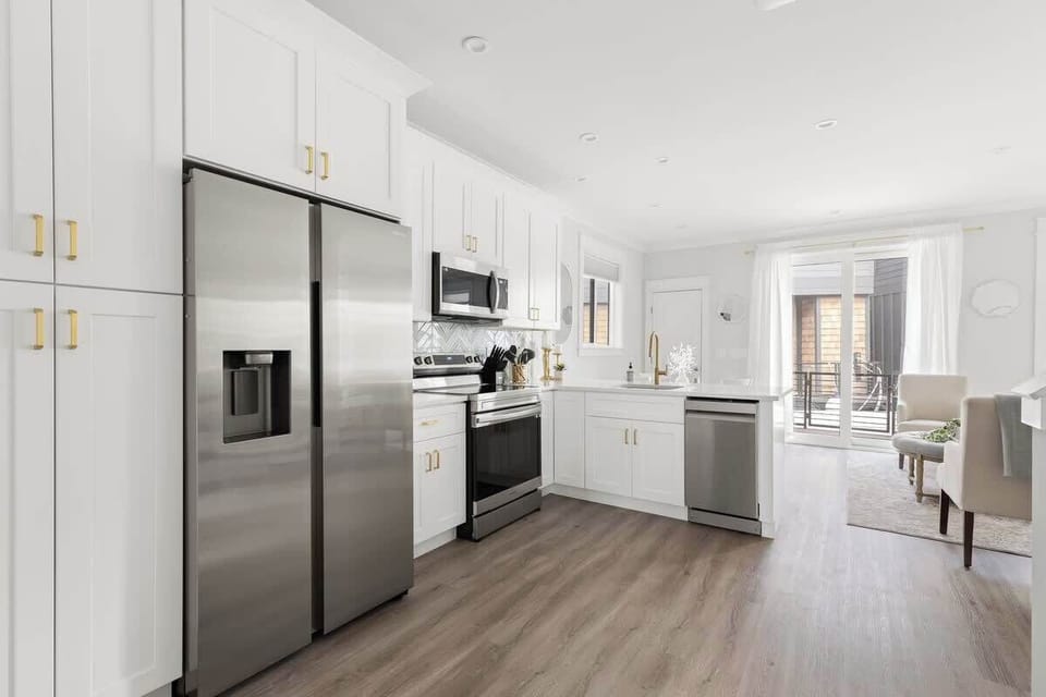 Open concept kitchen/dining/living space
