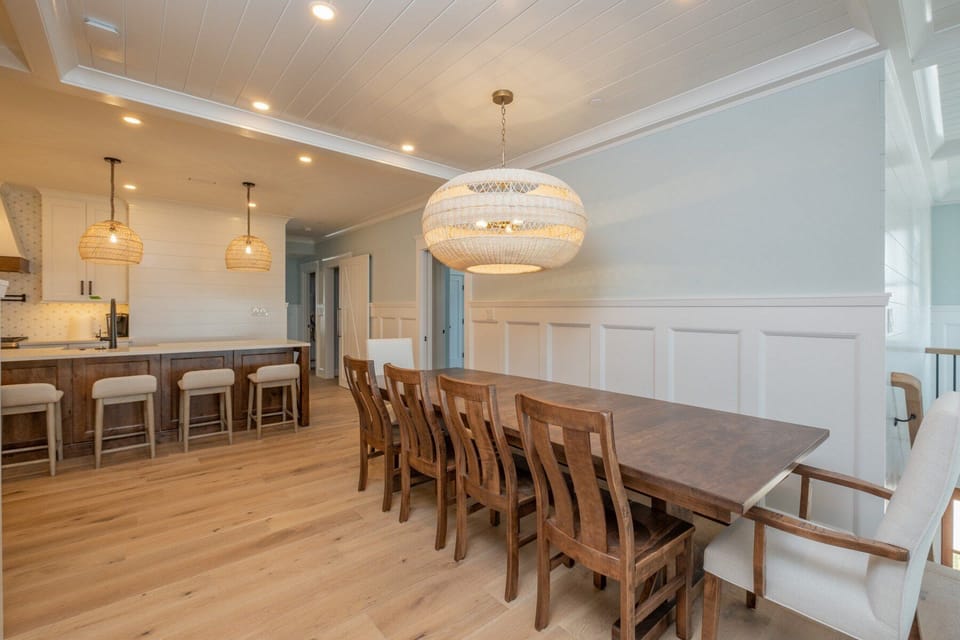 Dining table now with 5 side chairs and bench on the other side, seating for 12.