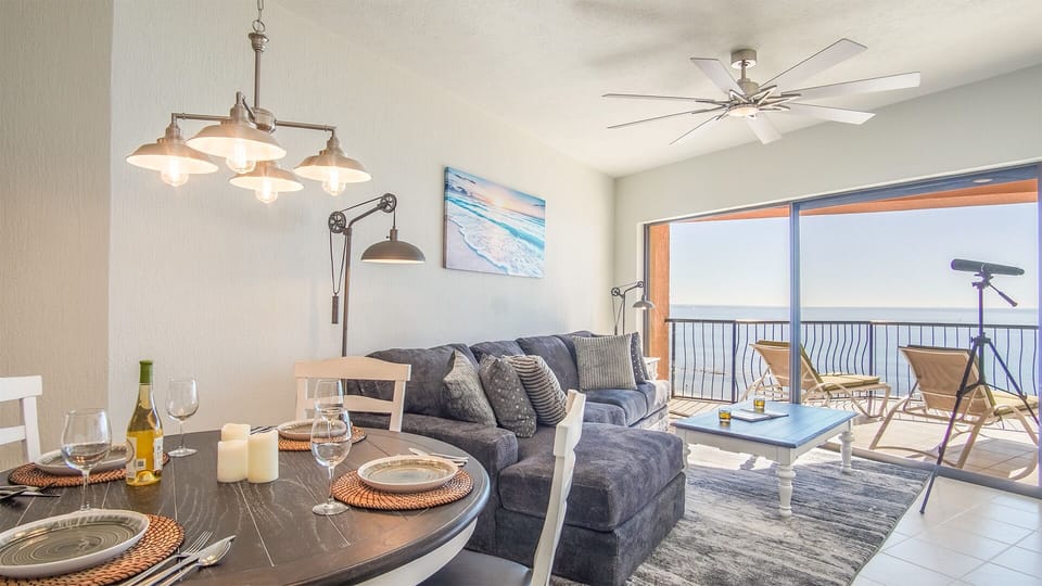 The main living area combines a dining table for four with the L shaped sofa in the living room.