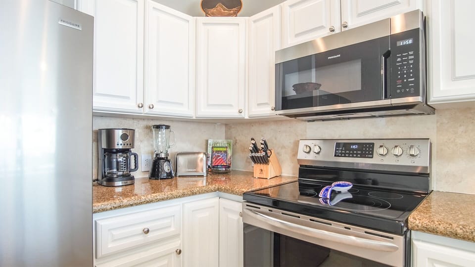 kitchen appliances, and stove.