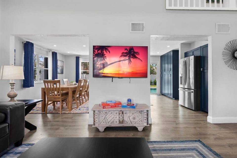 Open concept living and dining with pool views