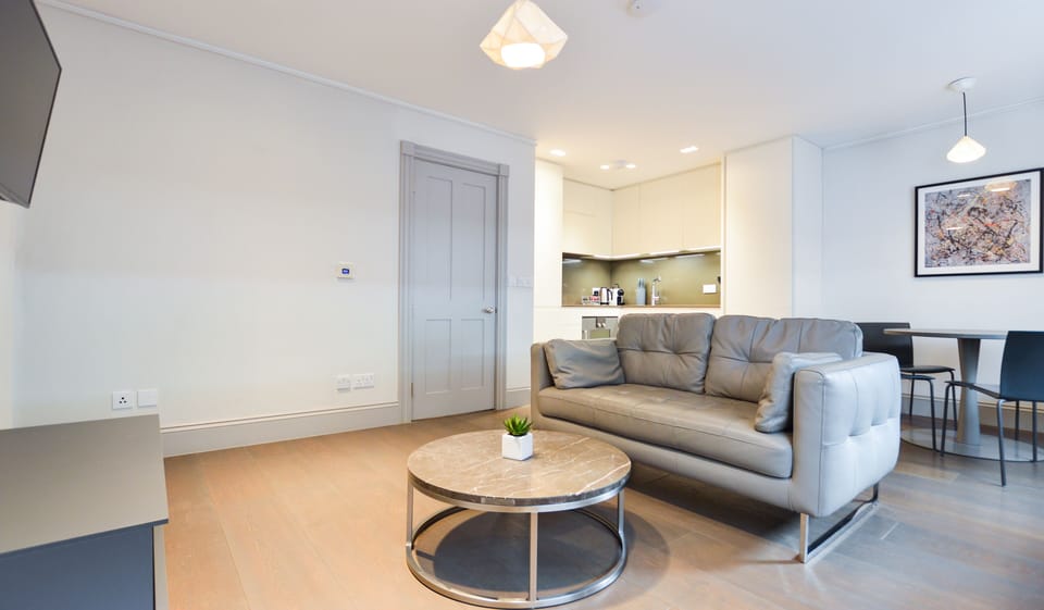Soho Luxury 1 Bedroom Apartment | Living area | Flat-screen TV, heated floors