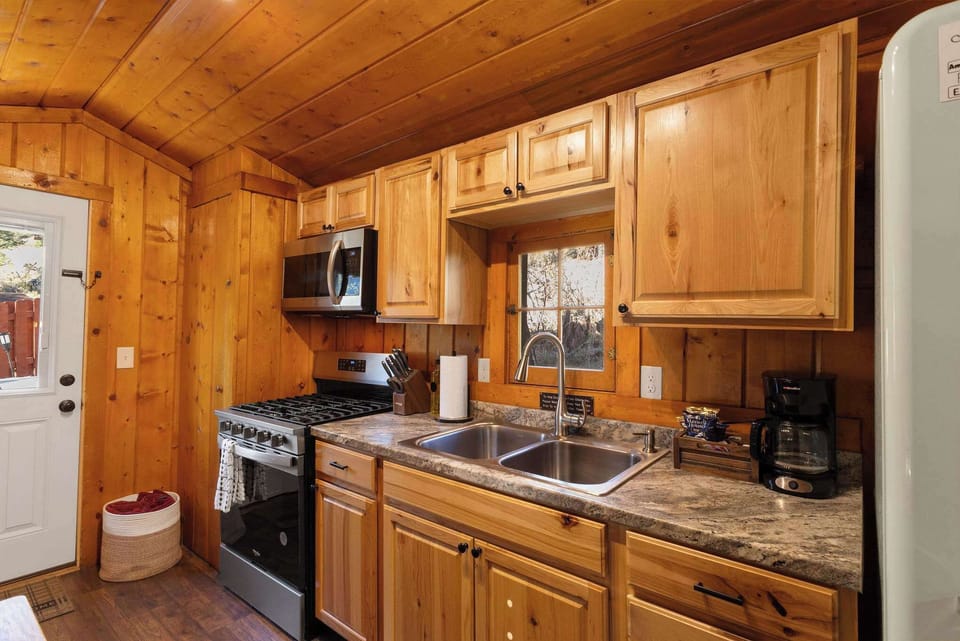 The kitchen is always stocked with dishes, cookware and utensils.