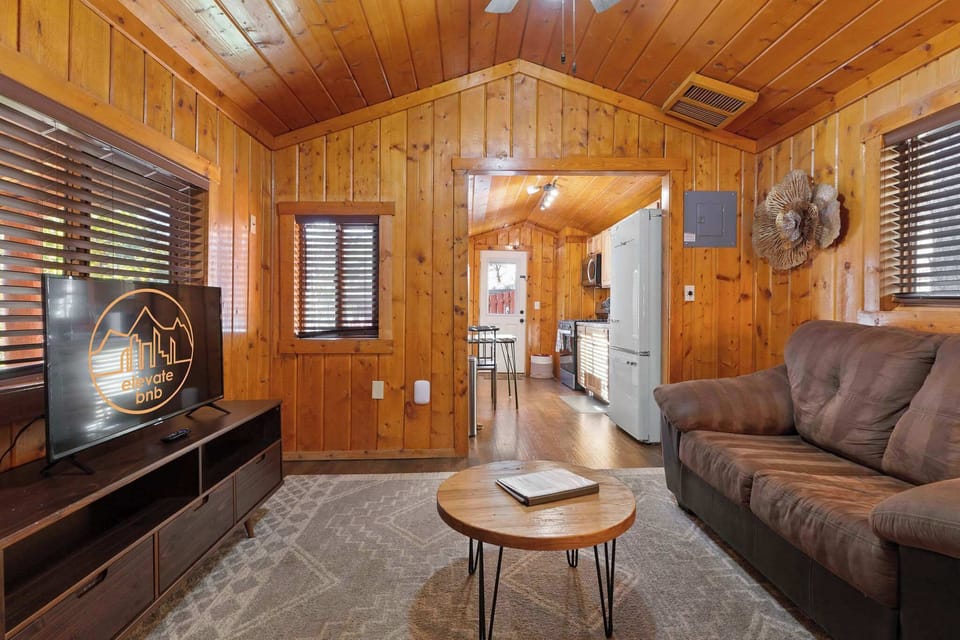 The kitchen is just past the living room.