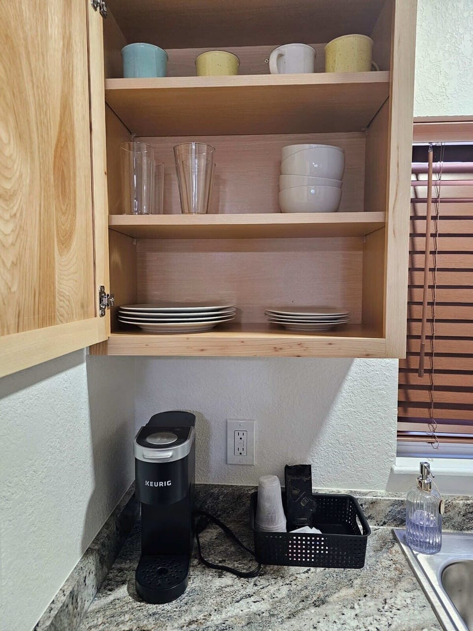 Plenty of plates, cups and complimentary coffee.