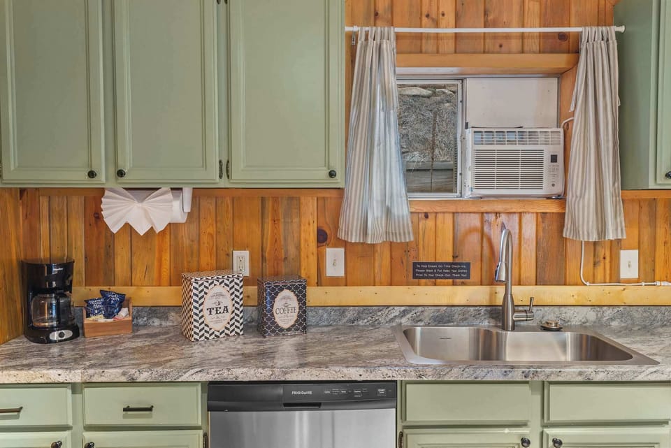 The kitchen is spacious and has full-sized stainless steel appliances.