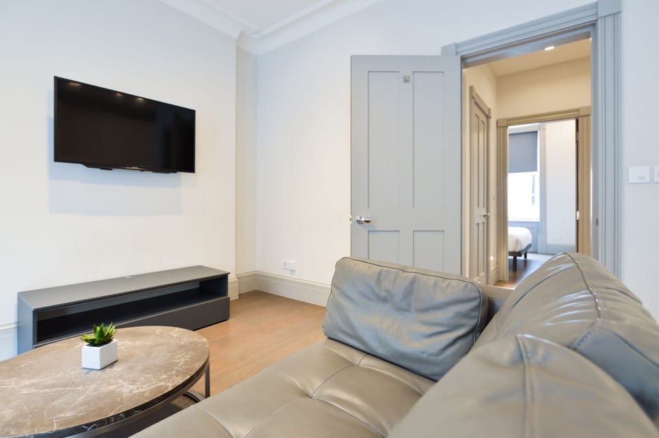 Soho Deluxe 1 Bedroom Apartment | Living area | Flat-screen TV, heated floors