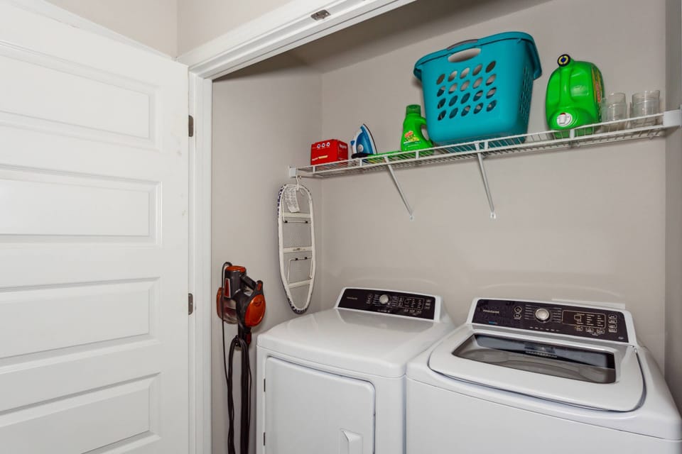 Laundry room with full size washer and dryer