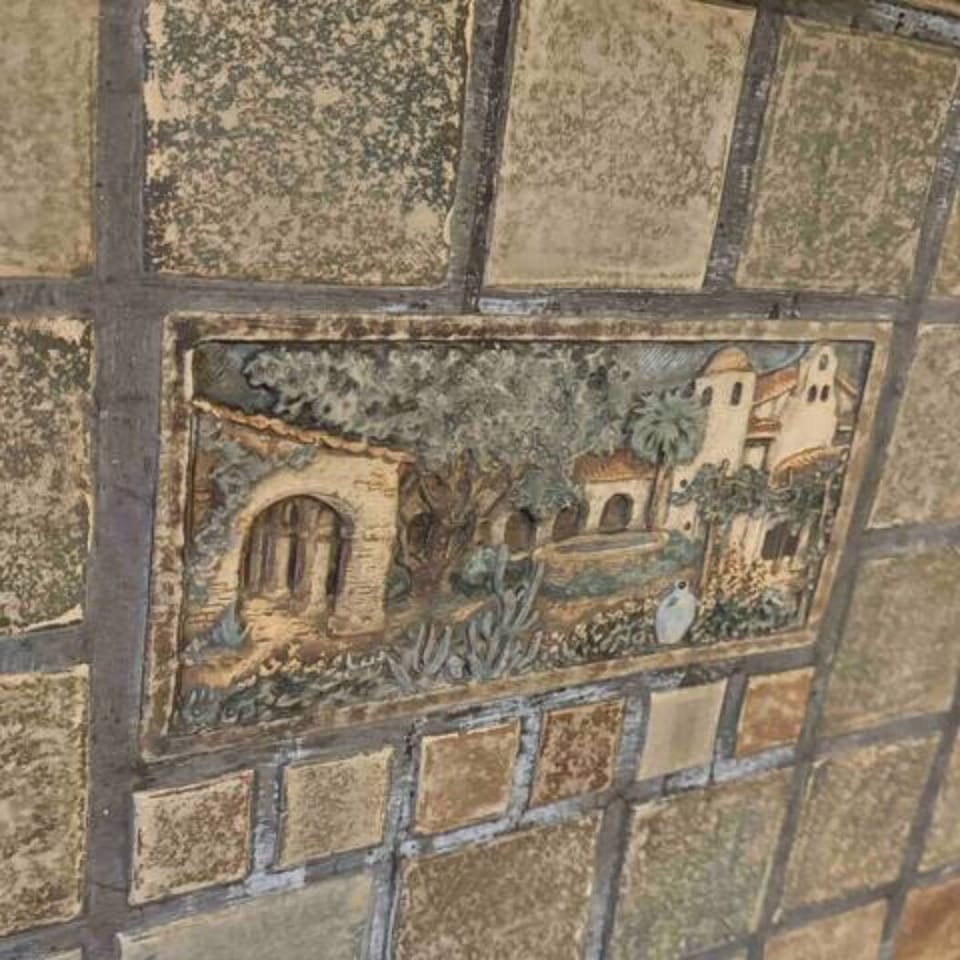 Larry Plumleigh Tiles on Decorative Fireplace.  Very unique to southern cali