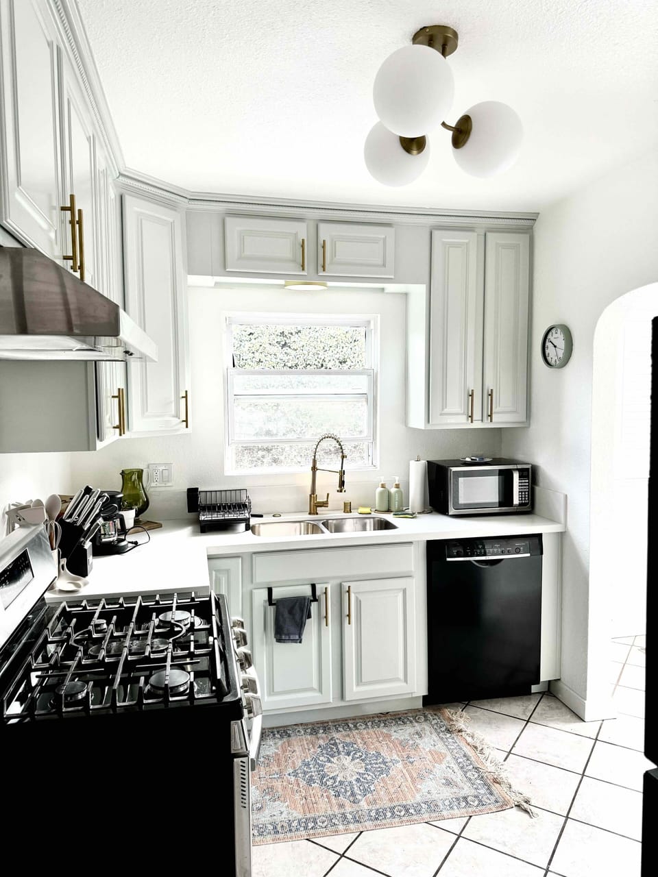Double Basin kitchen sink with pull out faucet. Dishwasher and microwave.