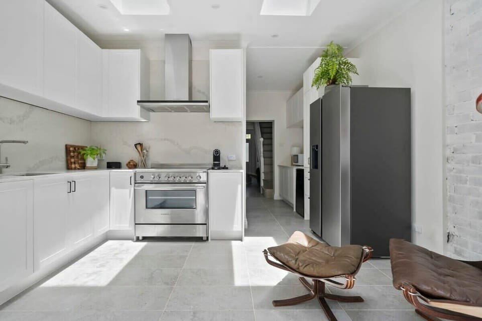Sleek, sunlit kitchen with modern flair.