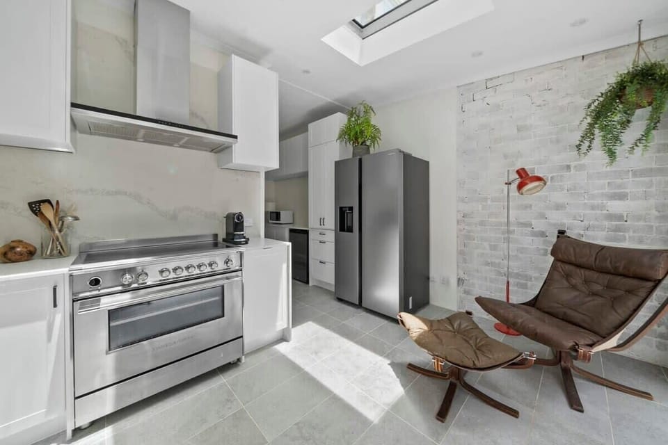 Bright, modern kitchen with a laid-back vibe — plenty of space to cook up a storm and then kick back in style.