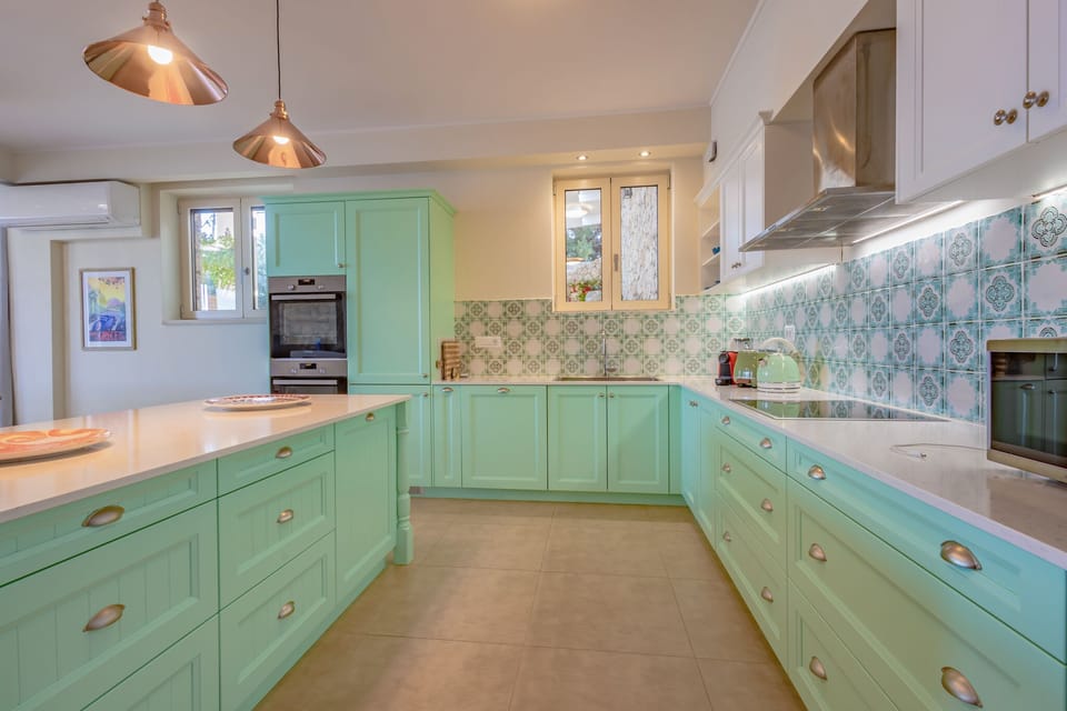 Fully equipped kitchen with two stoves and kitchen island