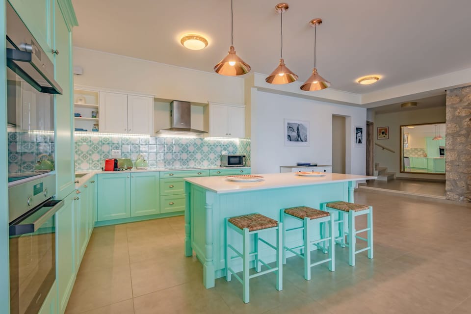 Fully equipped kitchen with two stoves and kitchen island