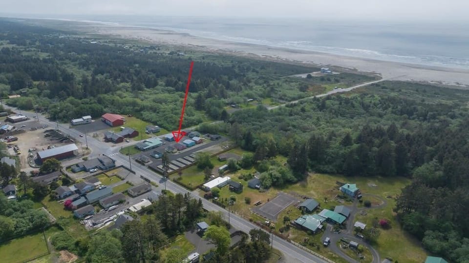 5 minute walk, flat and straight road to the beach approach (Restroom at the end of the road)