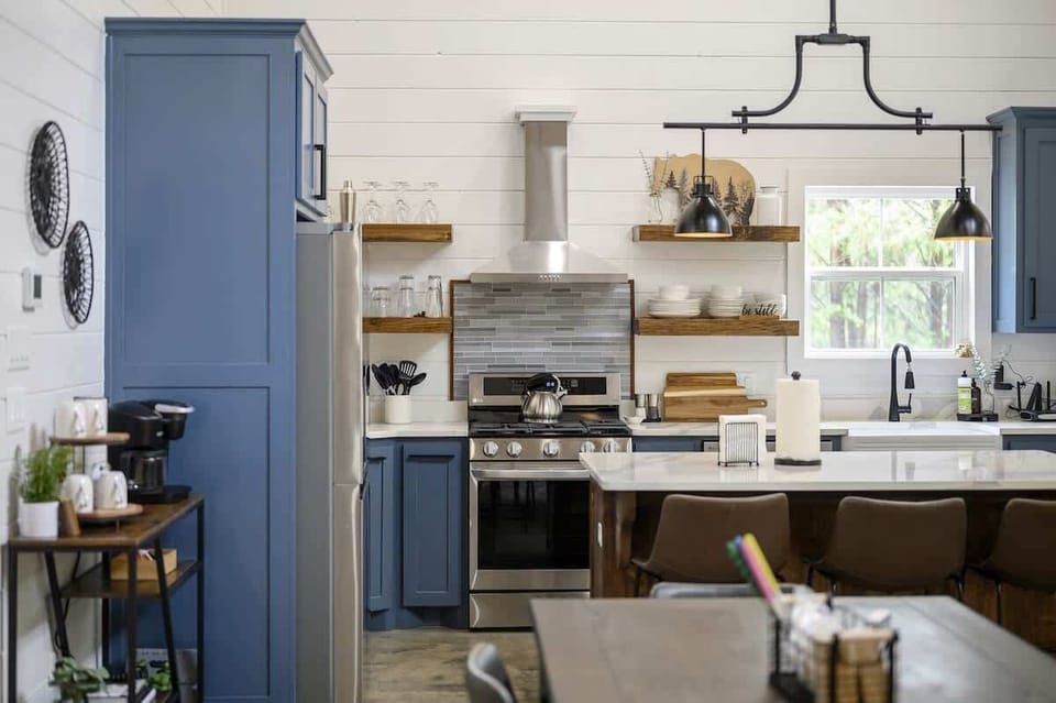 The kitchen provides plenty of room and counterspace to navigate the process of meal preparation.