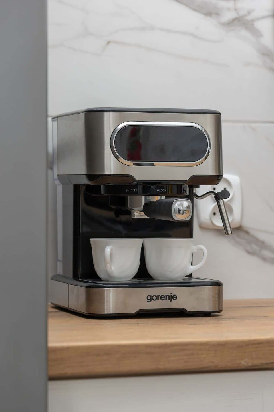 Kitchen with coffee machine.