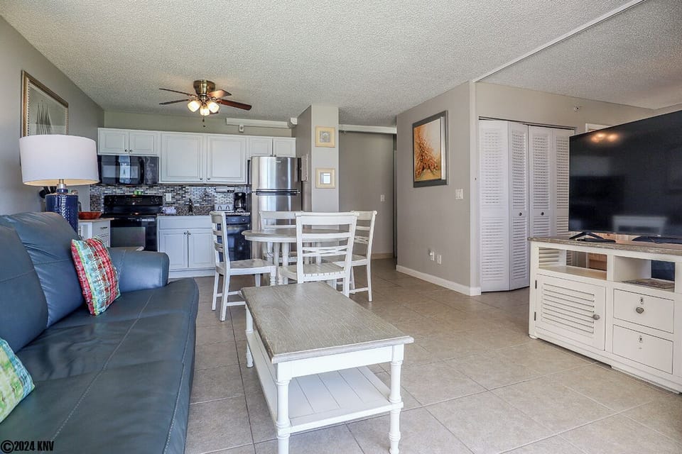 Open Living Space has a comfortable Sofa (sleeper), Huge TV and Dining Table for 4
