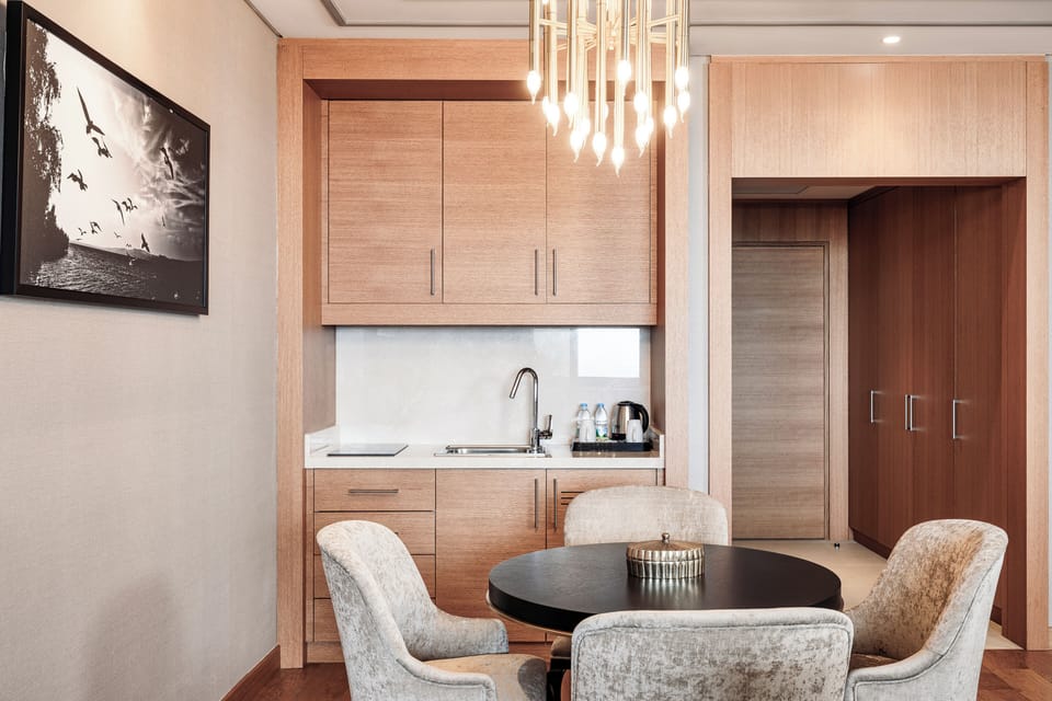 Junior Suite, Sea View | Minibar, in-room safe, laptop workspace, blackout drapes