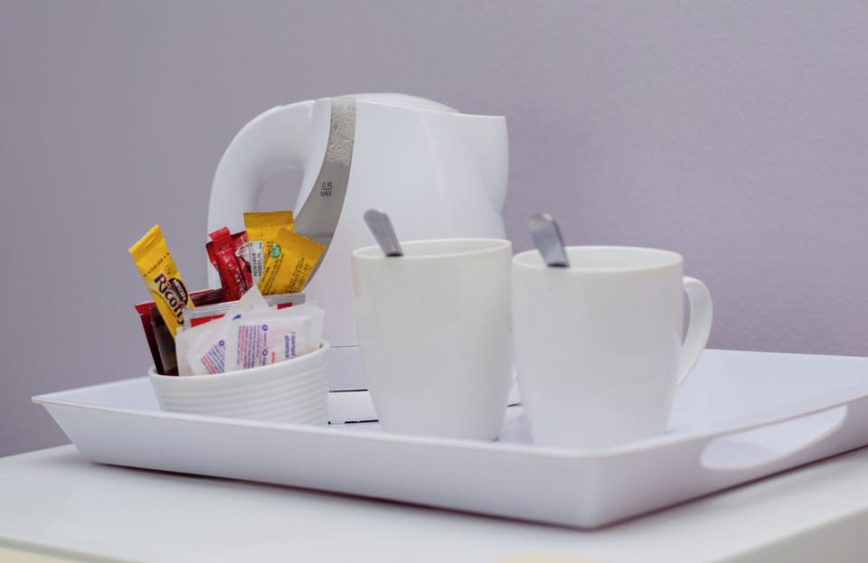 Individually decorated, desk, laptop workspace, iron/ironing board