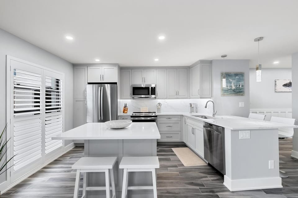 Gorgeous Kitchen with Quartz Countertops and Stainless Steel Appliances