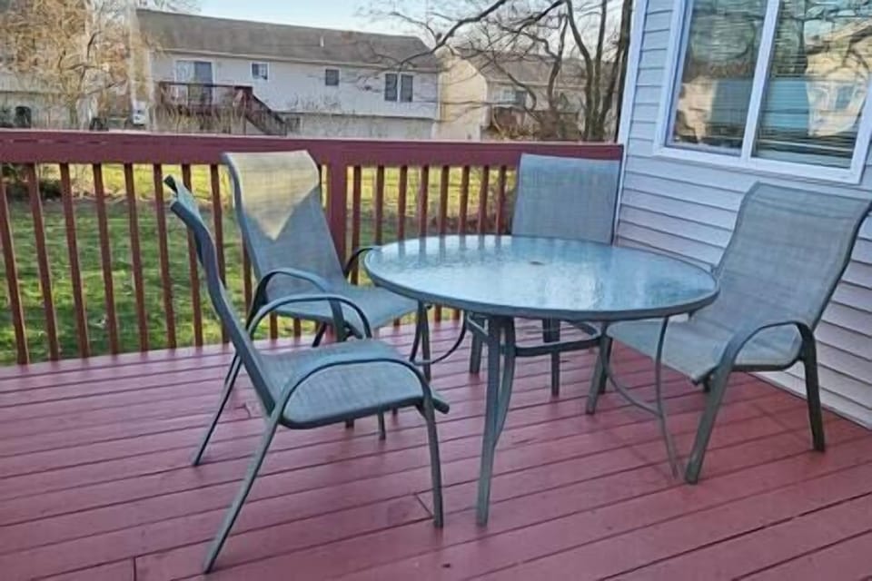 Patio Setting for a Nice Sunset Dinner in Warmer Weather. Fenced-in backyard in view.
