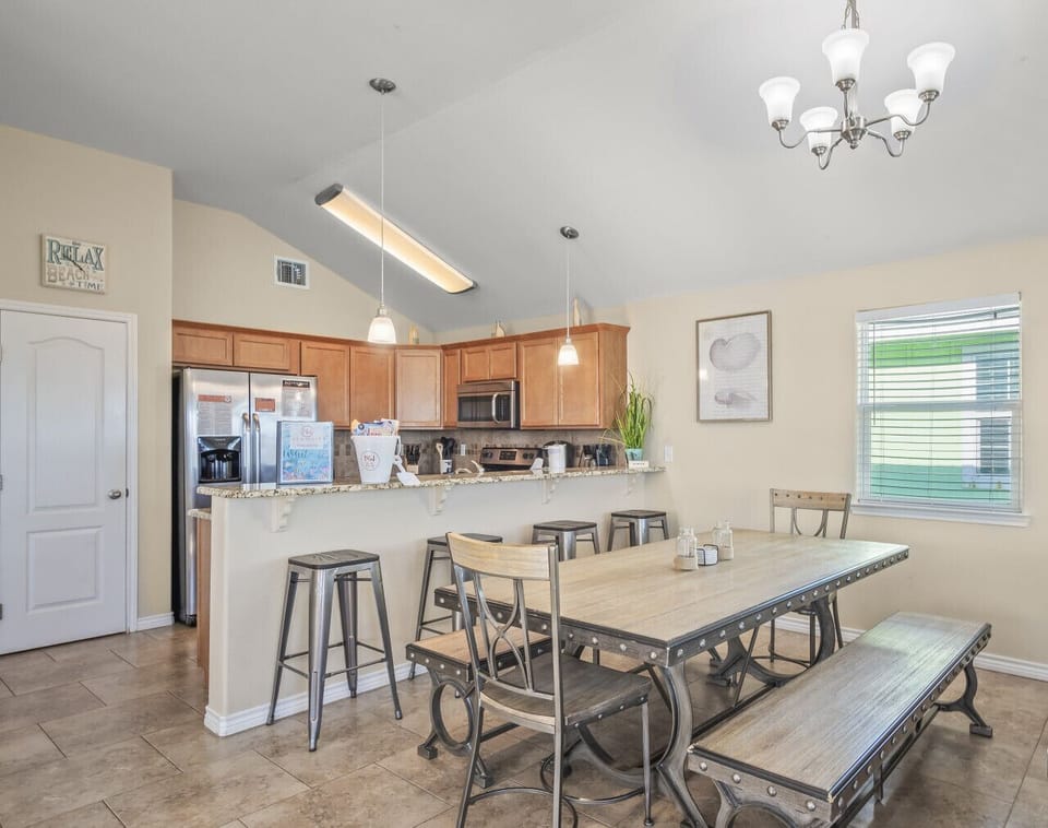 Large table and breakfast bar for group meals.