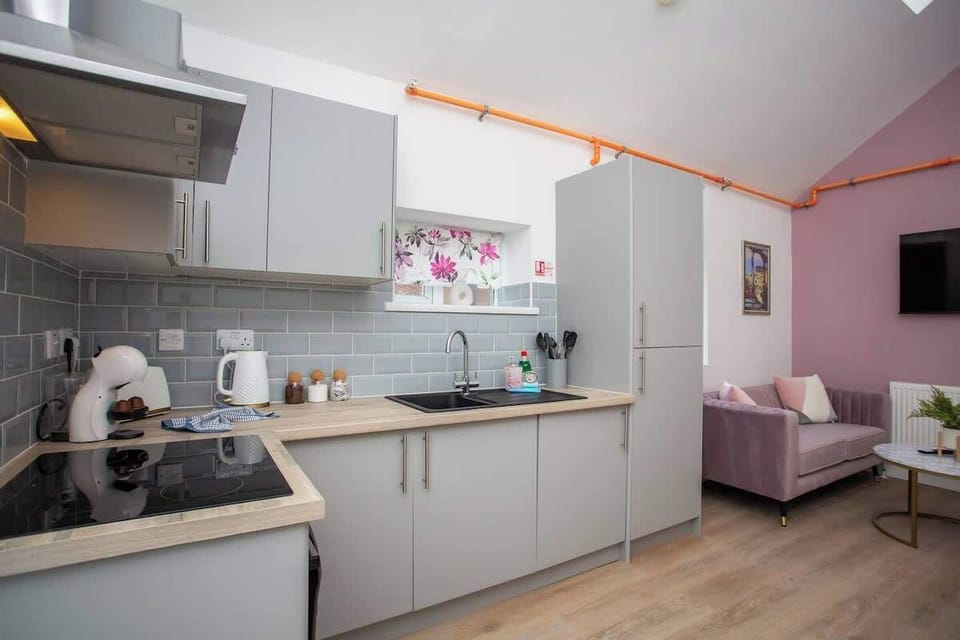 Step into the heart of your home, where culinary delights await in the sleek and modern kitchen.