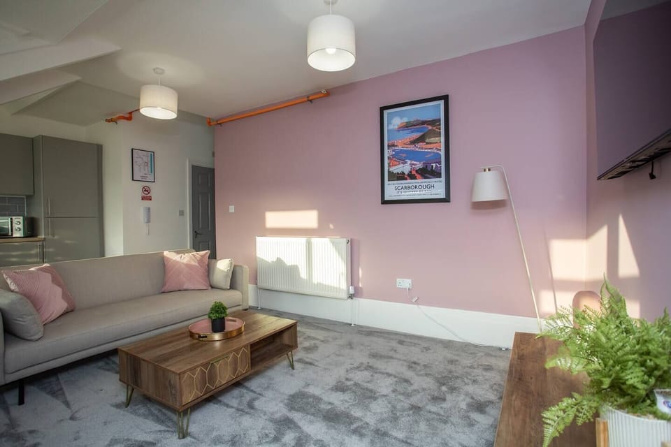  Step into your tranquil haven in the spacious living area, where coastal elegance meets modern comfort.