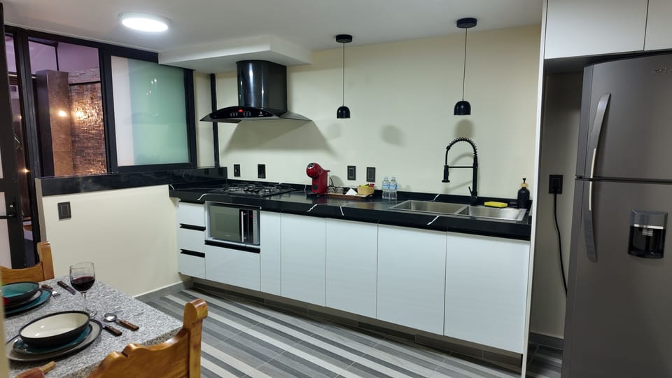 Luxury Studio Suite | Private kitchen | Stovetop, dishwasher, espresso maker, coffee/tea maker