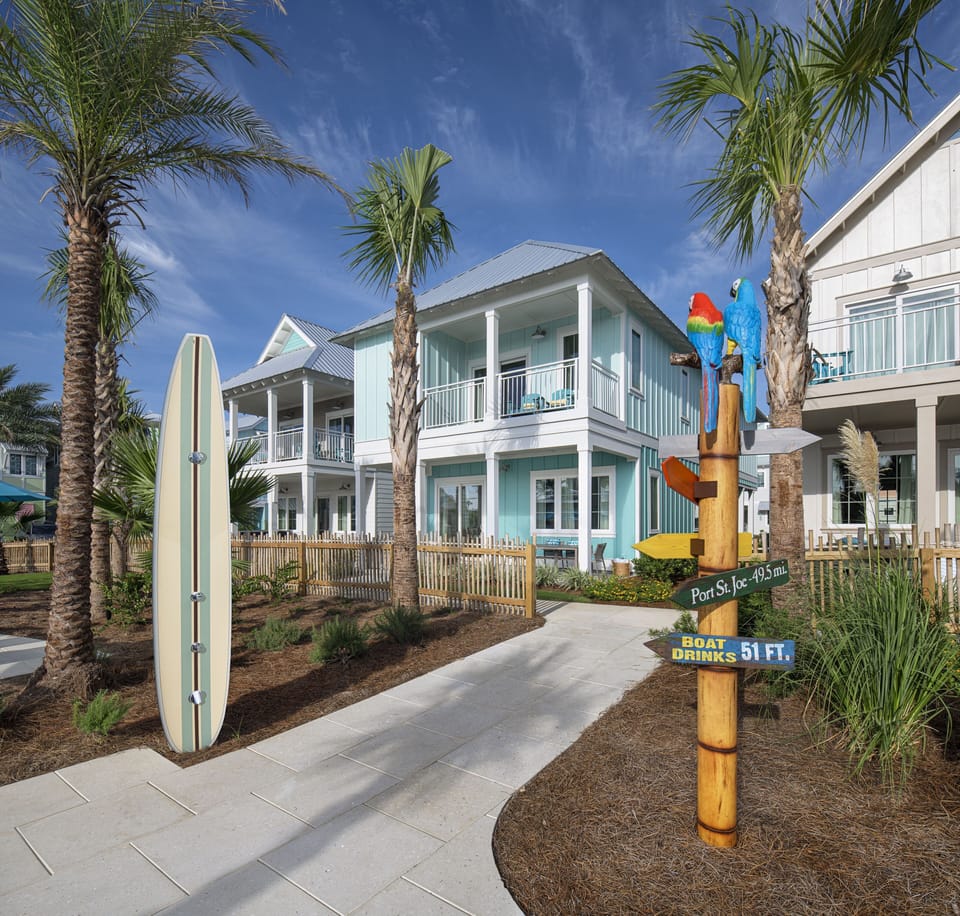 Step into island-inspired charm where palm-lined paths and breezy vibes set the tone for your coastal escape.