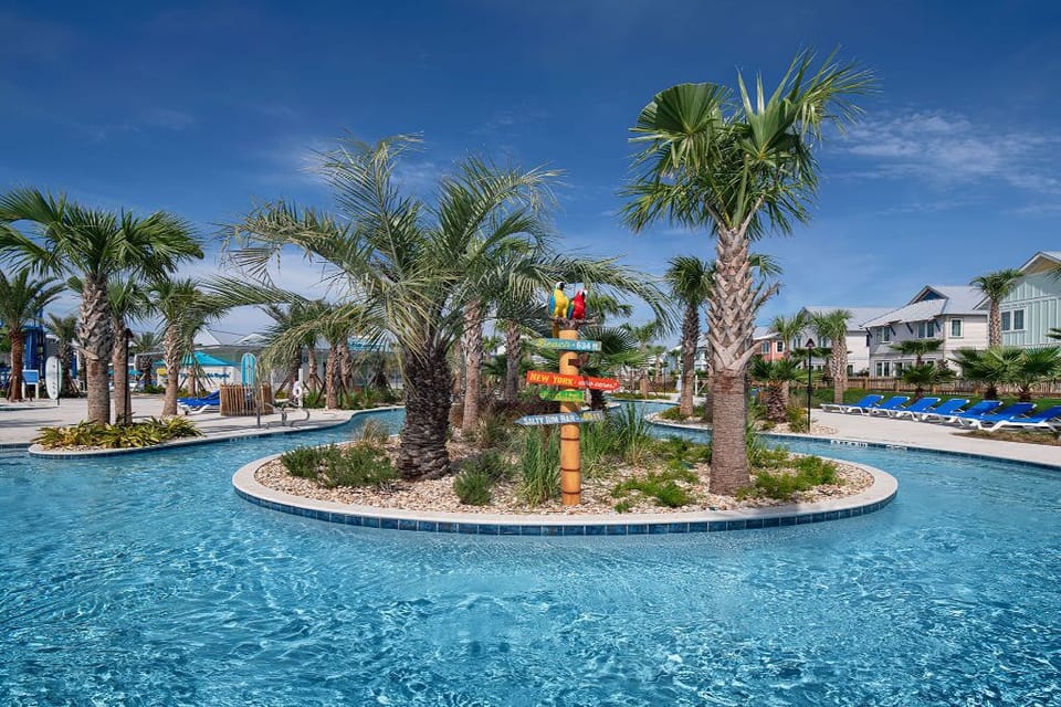 Dive into relaxation surrounded by swaying palms and a shimmering pool, perfect for lazy days