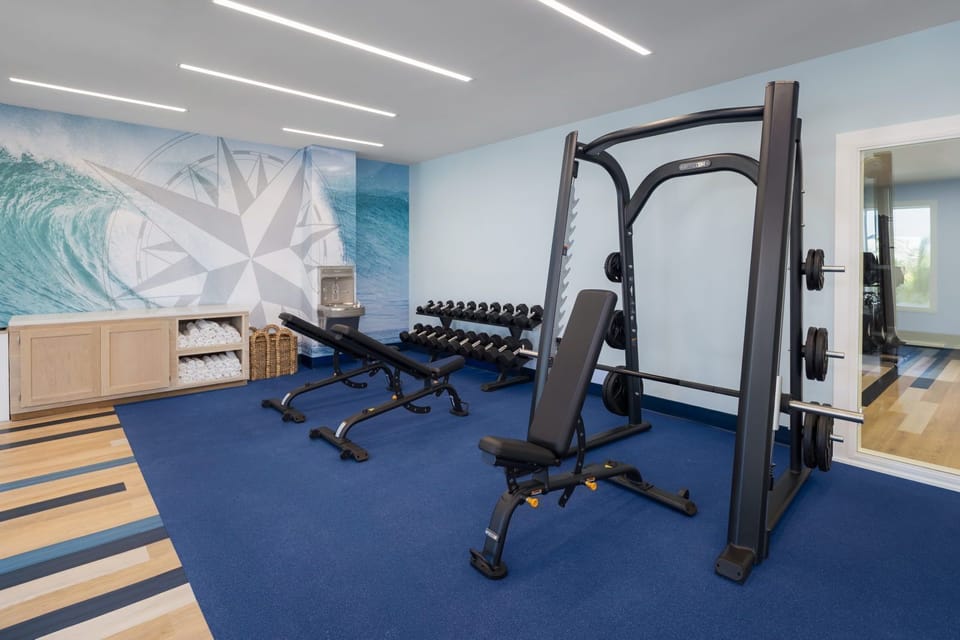 Stay energized in the modern fitness area, complete with sleek equipment and refreshing decor.