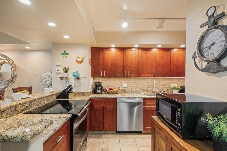 Fully equipped kitchen with granite countertops and open dining view