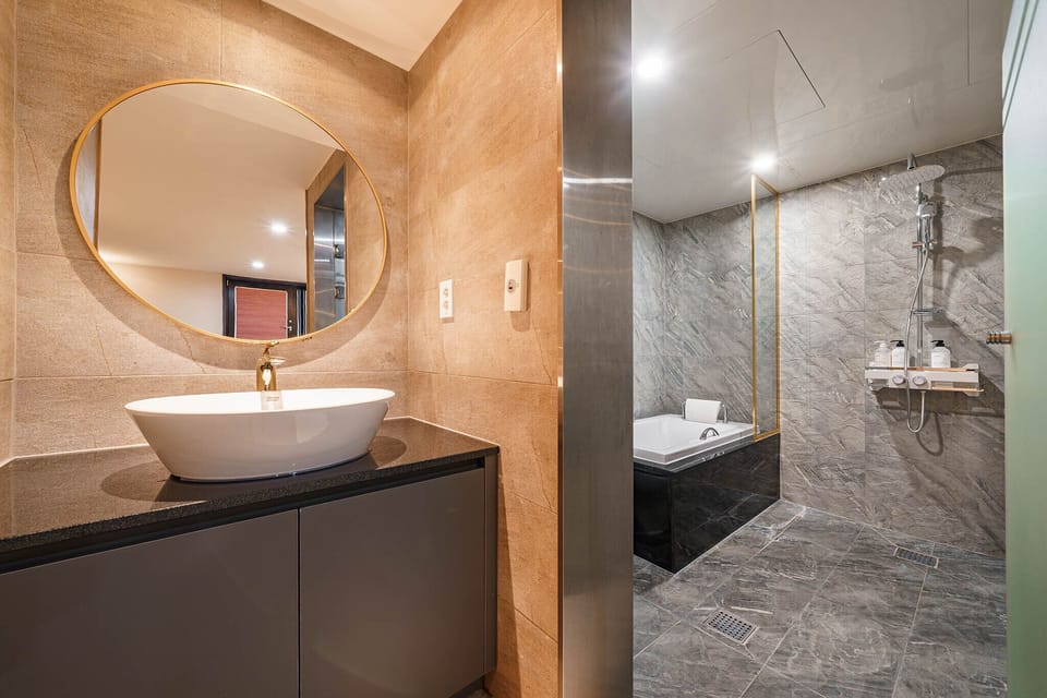 Rainfall showerhead, designer toiletries, hair dryer, bathrobes