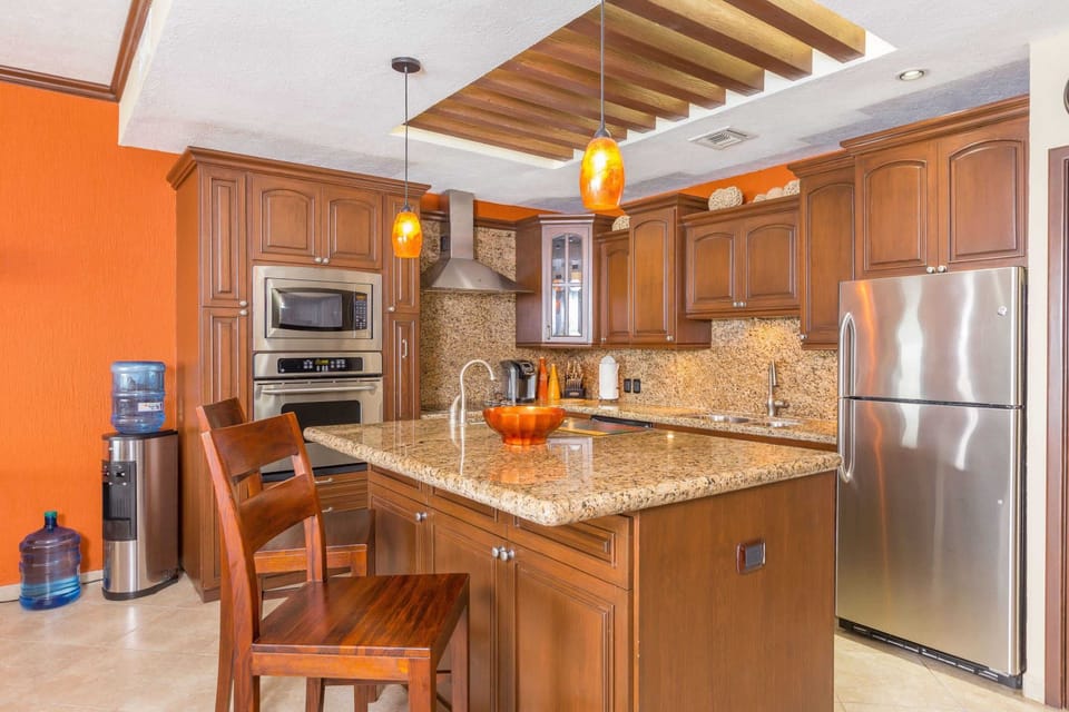 Large Kitchen With 2 Bar Stools and Island